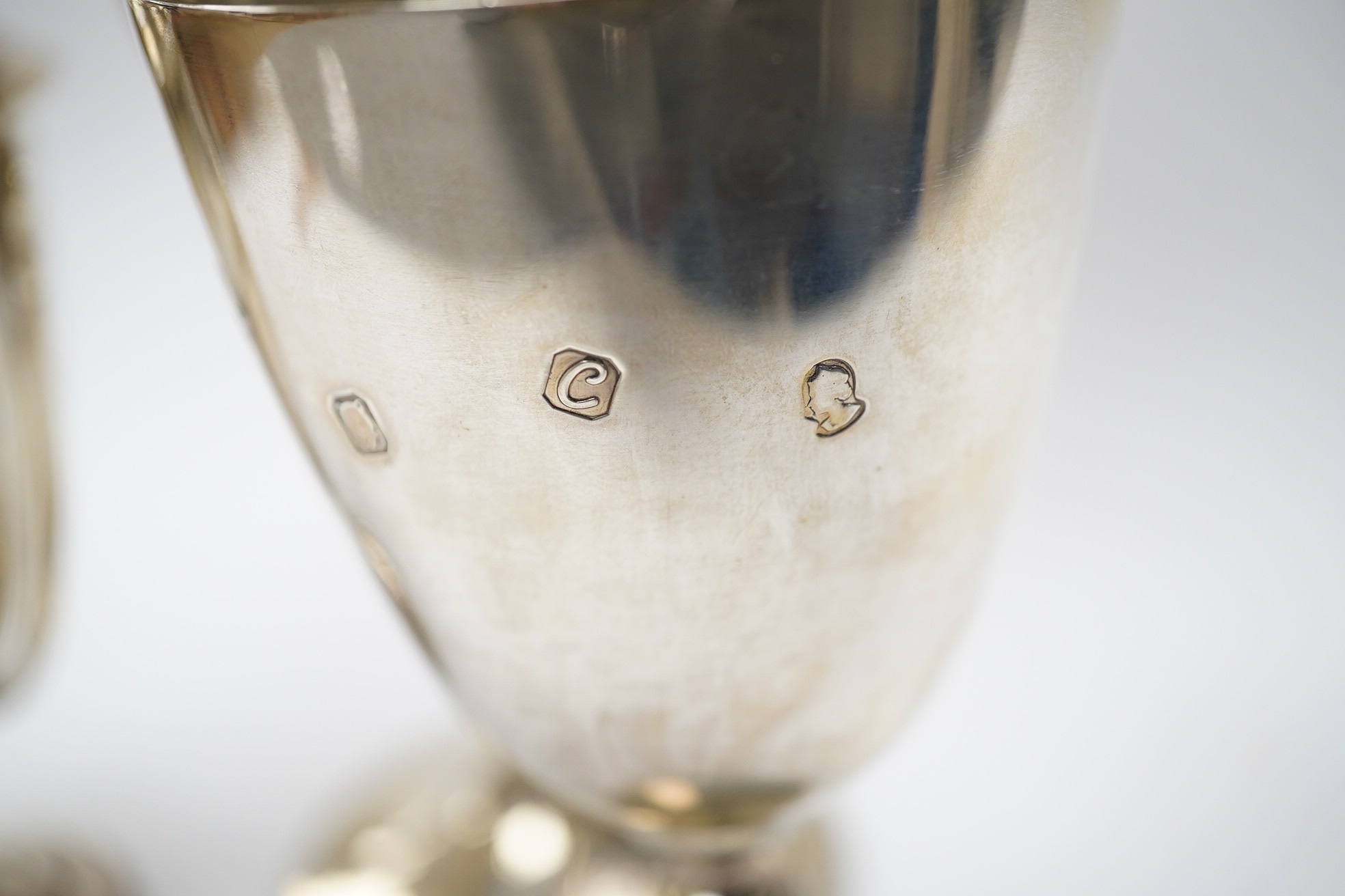 A Victorian engraved silver presentation goblet, with Masonic inscription, London, 1880, 19.5cm, together with a modern silver presentation goblet and a silver two handled presentation trophy cup and cover, 20.2oz. Condi